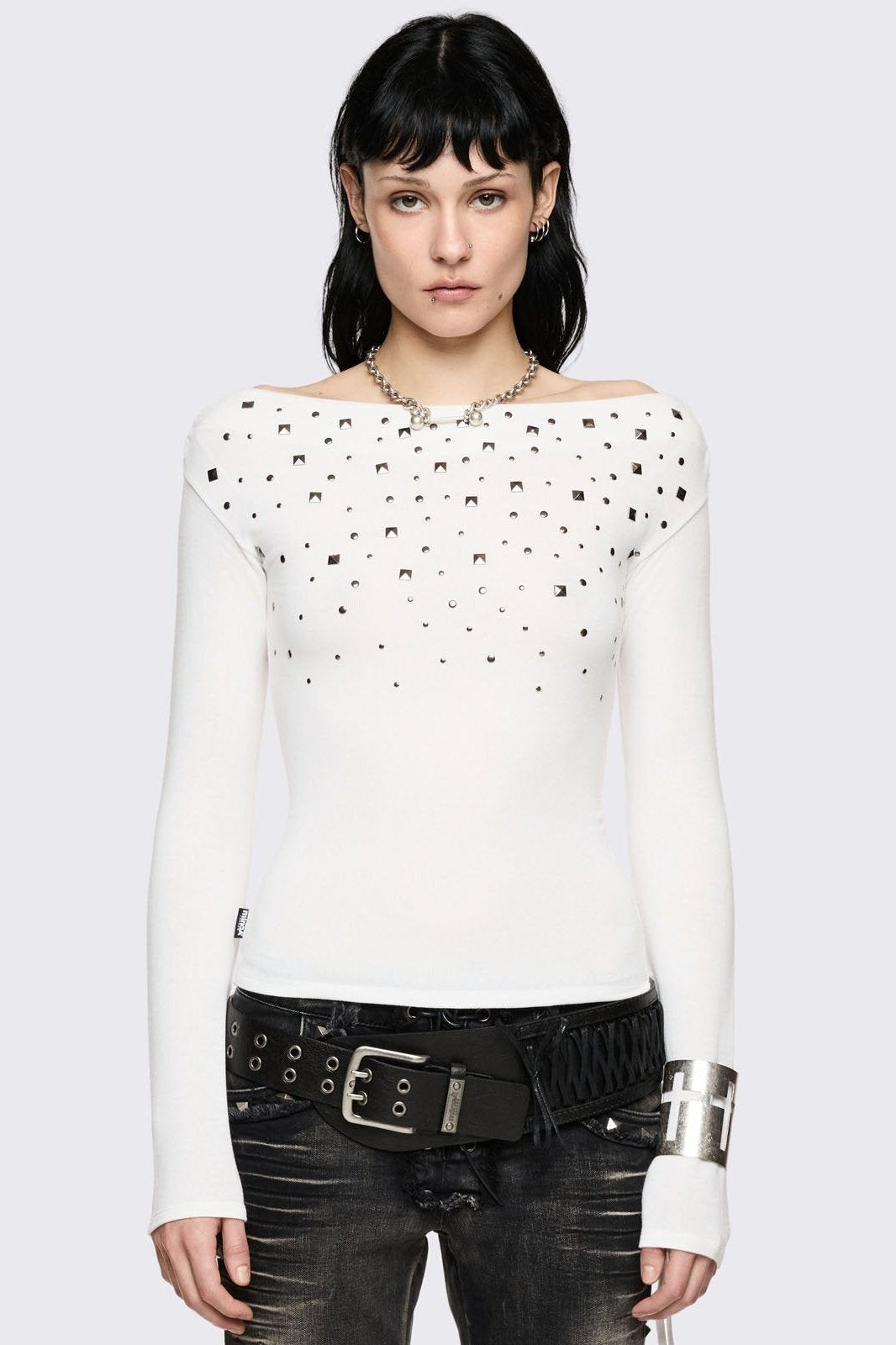 White off-shoulder long sleeve top and stud details.  