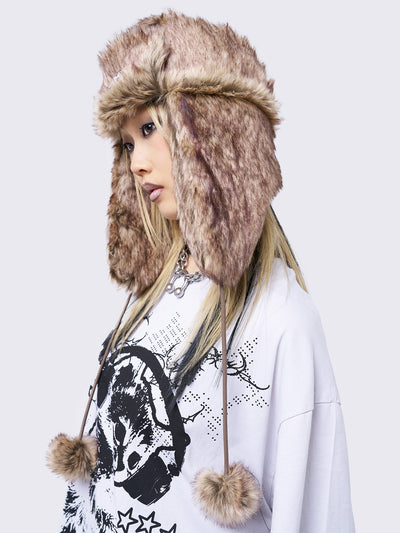 Beige faux fur trapper hat with minga rubber logo detail and ear flaps