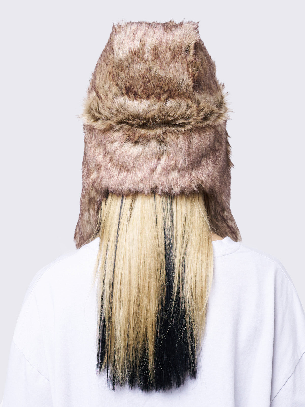 Beige faux fur trapper hat with minga rubber logo detail and ear flaps