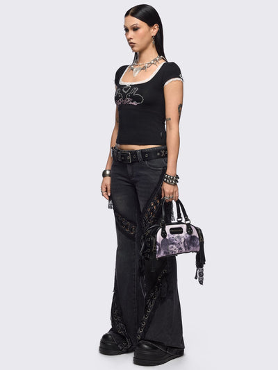 Black and pink bowling bag with kittens graphic print, rhinestone details and side exterior pockets with lace up bows.
