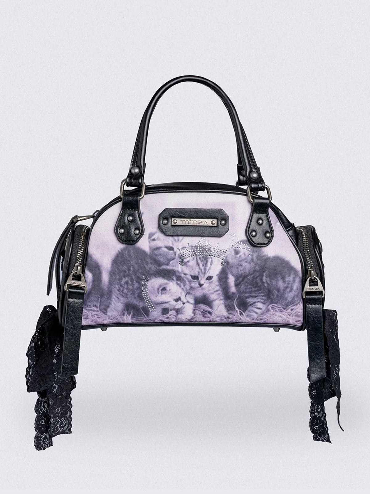 Black and pink bowling bag with kittens graphic print, rhinestone details and side exterior pockets with lace up bows.