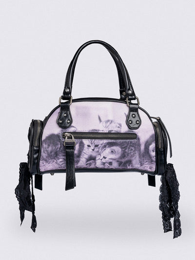 Black and pink bowling bag with kittens graphic print, rhinestone details and side exterior pockets with lace up bows.