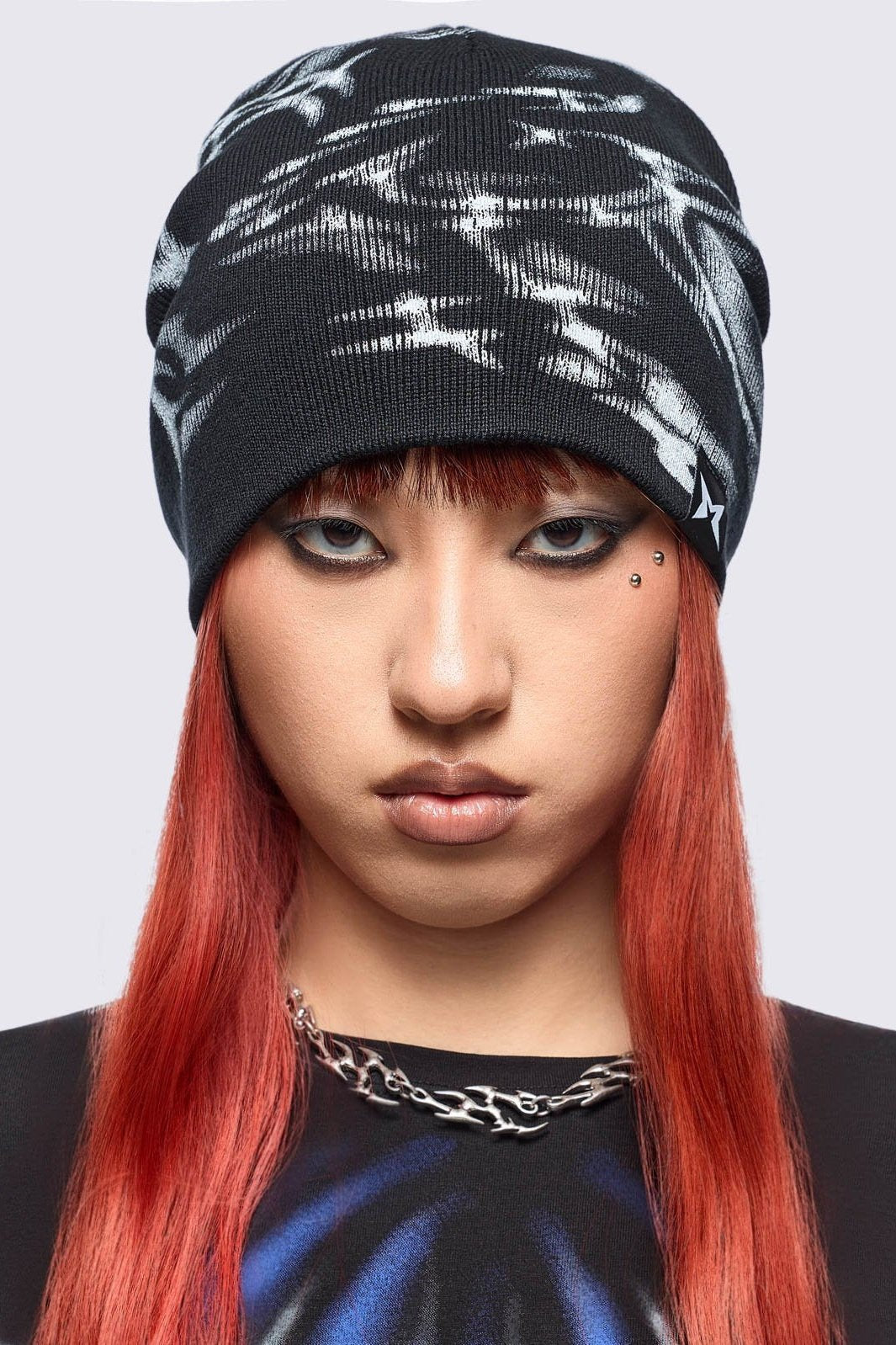 Black beanie hat featuring a graphic print by cold𝐹33t.