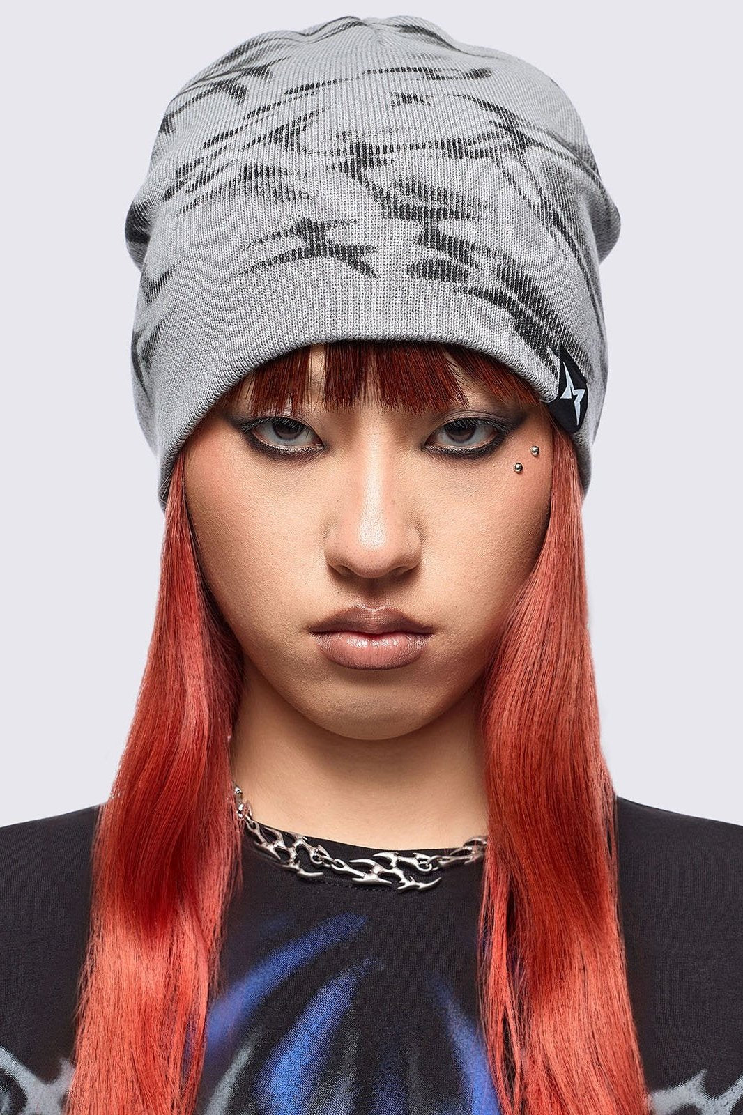 Grey beanie hat featuring a graphic print by cold𝐹33t designer.