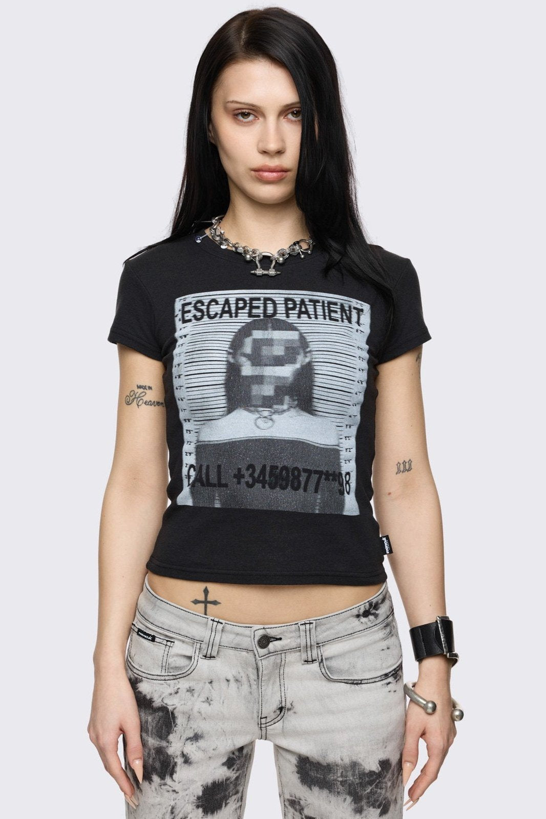 Black baby tee with mugshot graphic front print. 