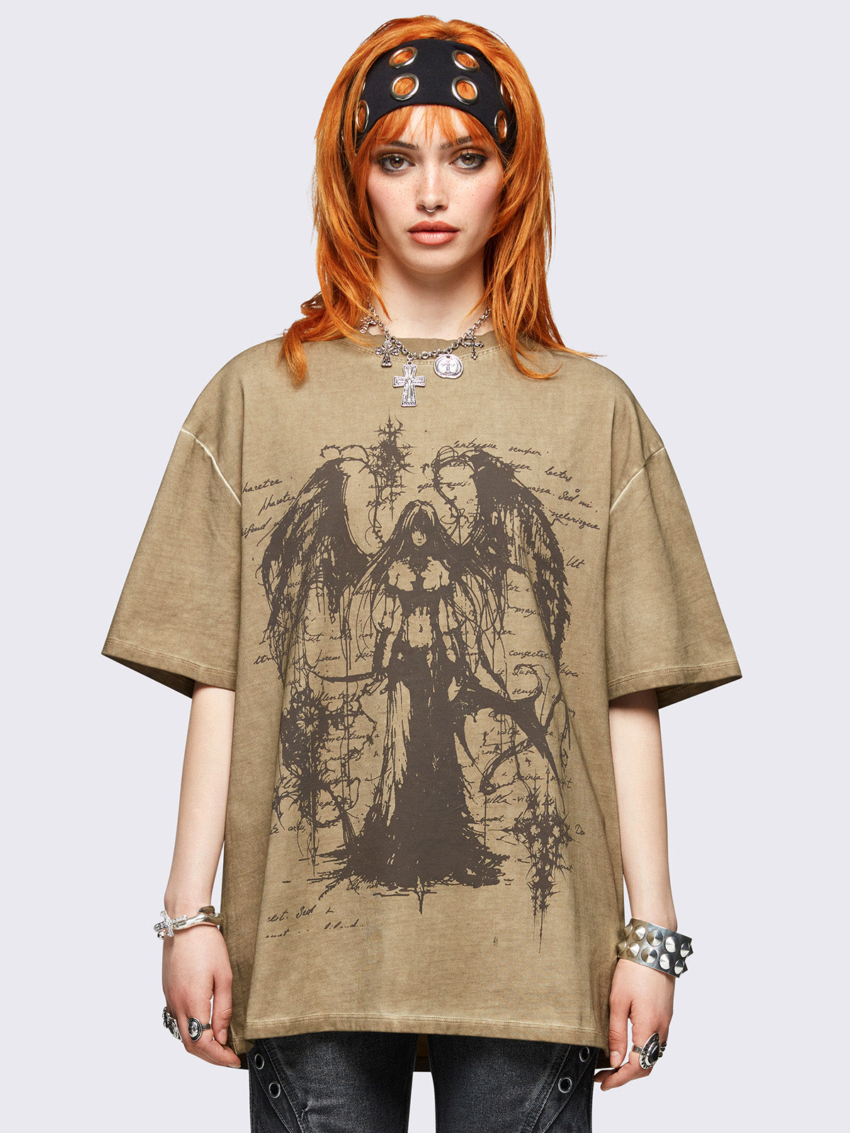 Brown washed oversized t-shirt featuring dark angel graphic front print.