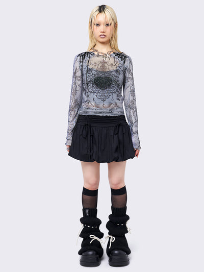 Black puffball mini skirt with a ruched tie-front and bow detail, featuring a voluminous balloon-style silhouette.