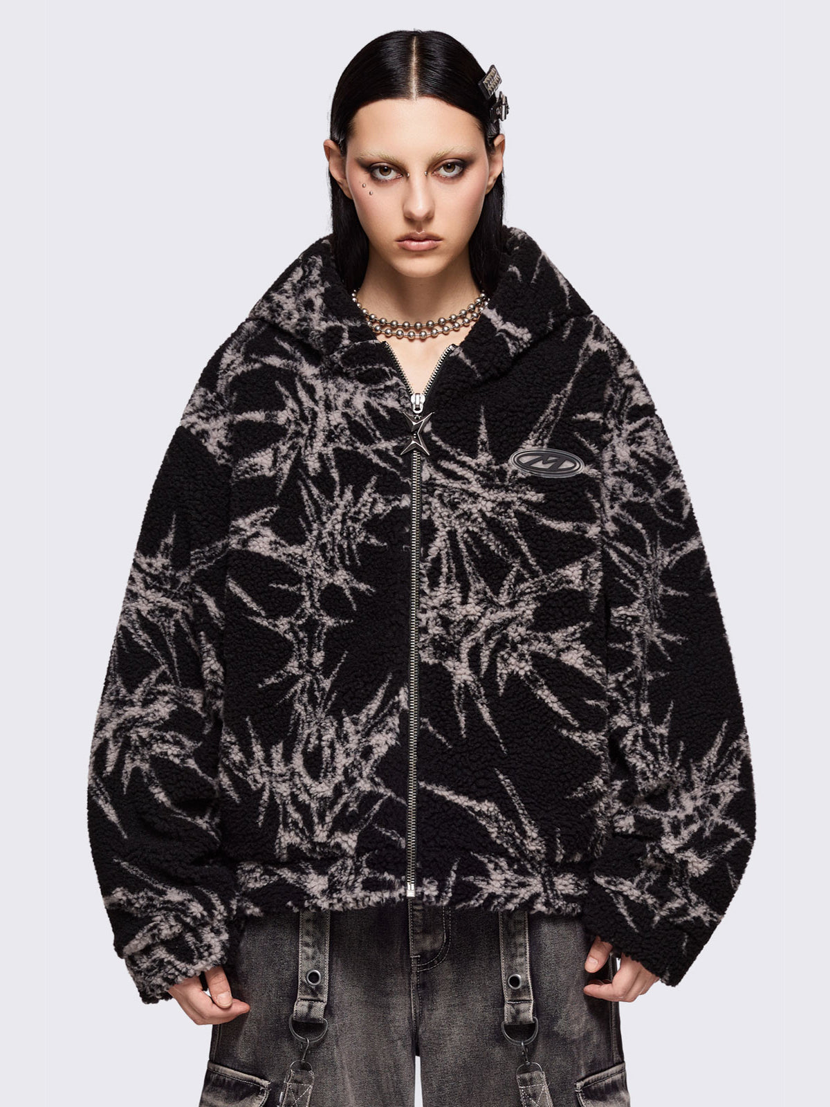 Black fleece borg hoodie jacket featuring all over grey thorns design.