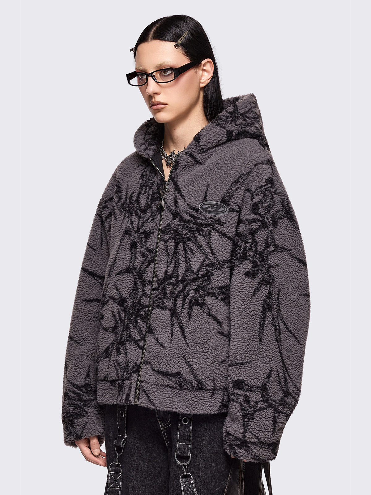 Grey fleece borg hoodie jacket featuring all over black thorns design.