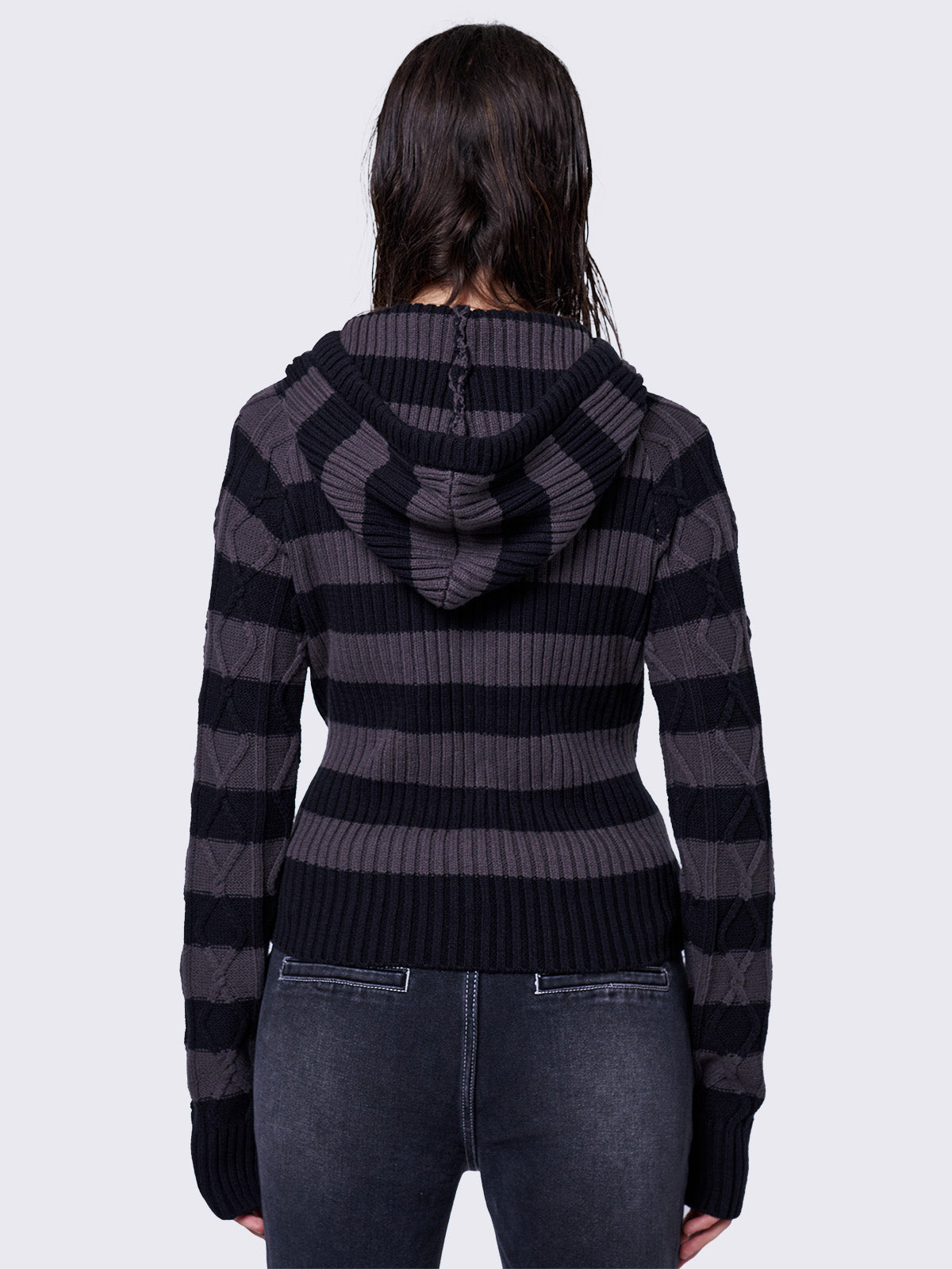 Cable-knit hooded jumper with grey and black stripes, featuring a half-button placket for added detail.