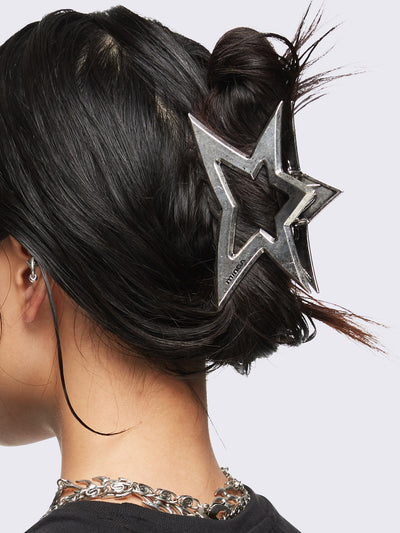 Metal hair claw clip featuring a star design.