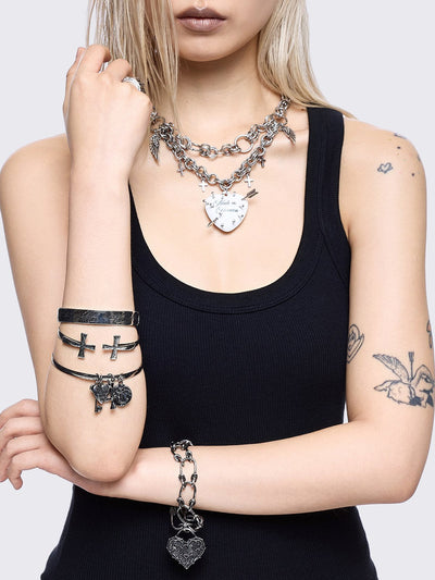 Set of 4 bracelets with cross design and heart pendants