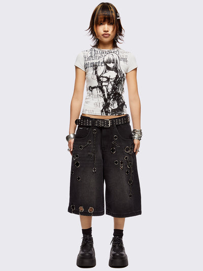 Black washed longline denim shorts with eyelets, chains, safety pins and more metal hardware details. Streetwear, grunge and y2k vibes.