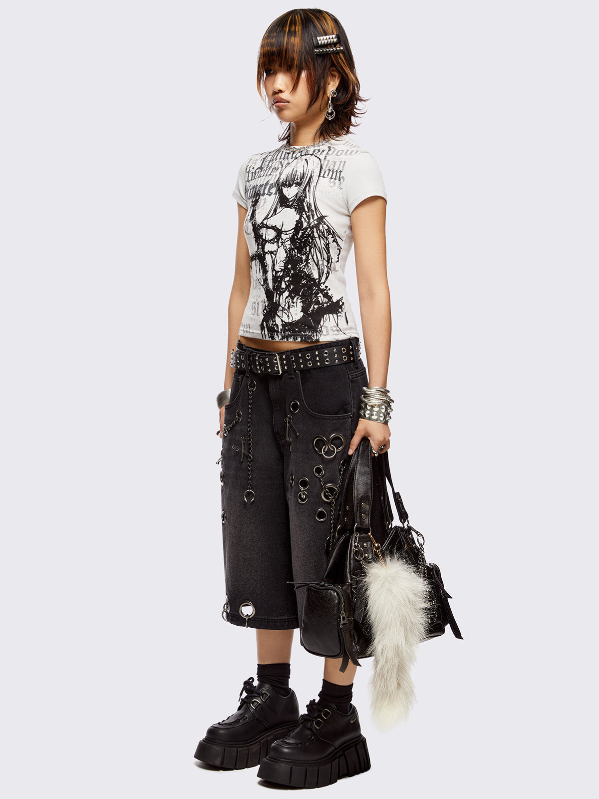 Black washed longline denim shorts with eyelets, chains, safety pins and more metal hardware details. Streetwear, grunge and y2k vibes.