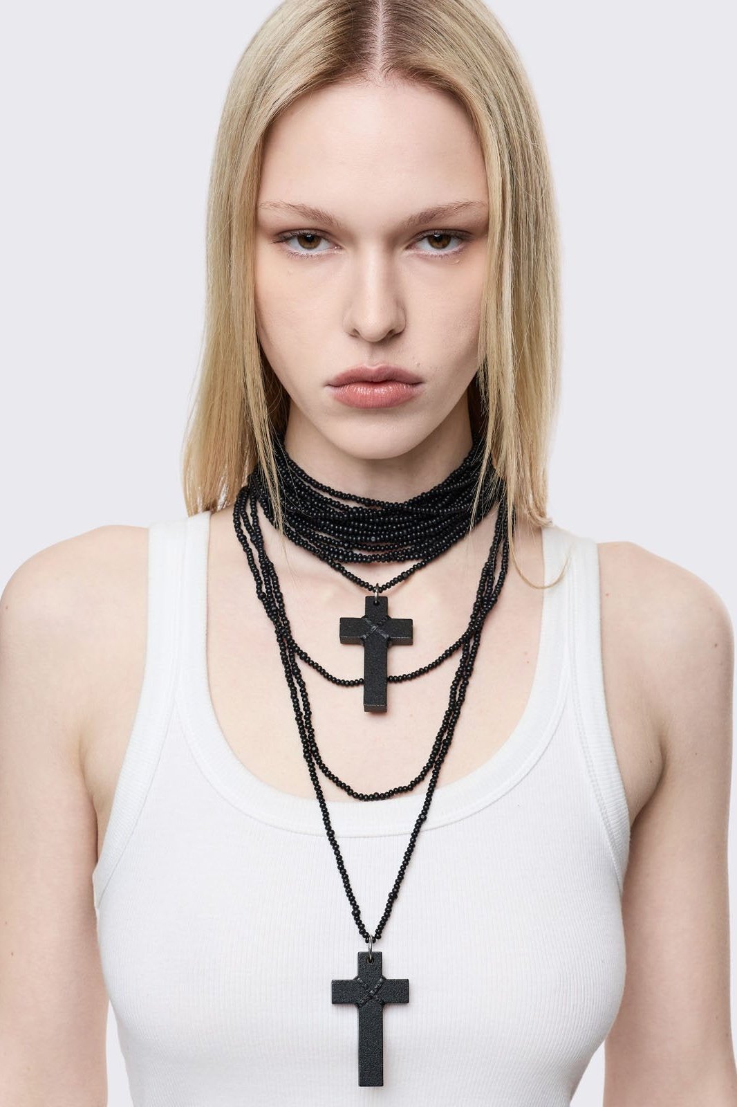 Black multi-layered beaded necklace with cross pendants