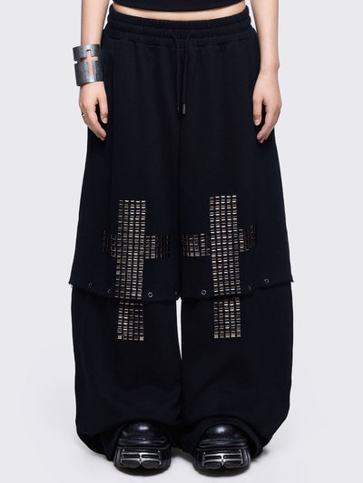 Black sweatpants with silver studded cross, "Reverse" patch back and detachable-leg .