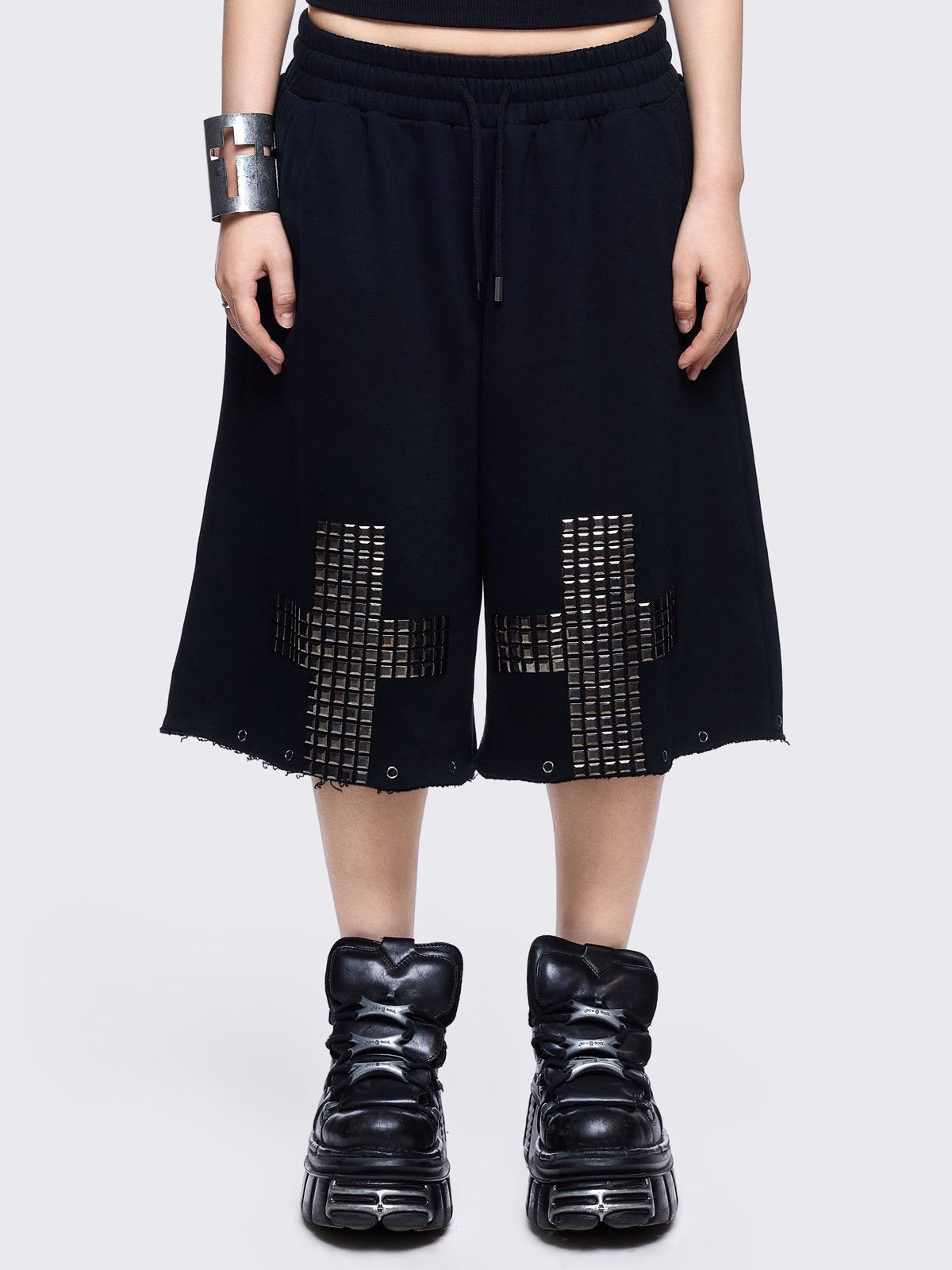 Black sweatpants with silver studded cross, 