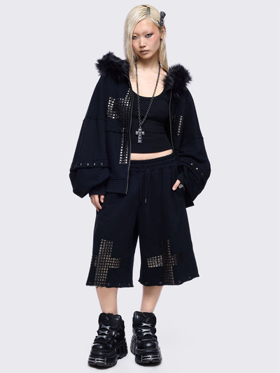 Black sweatpants with silver studded cross, "Reverse" patch back and detachable-leg .