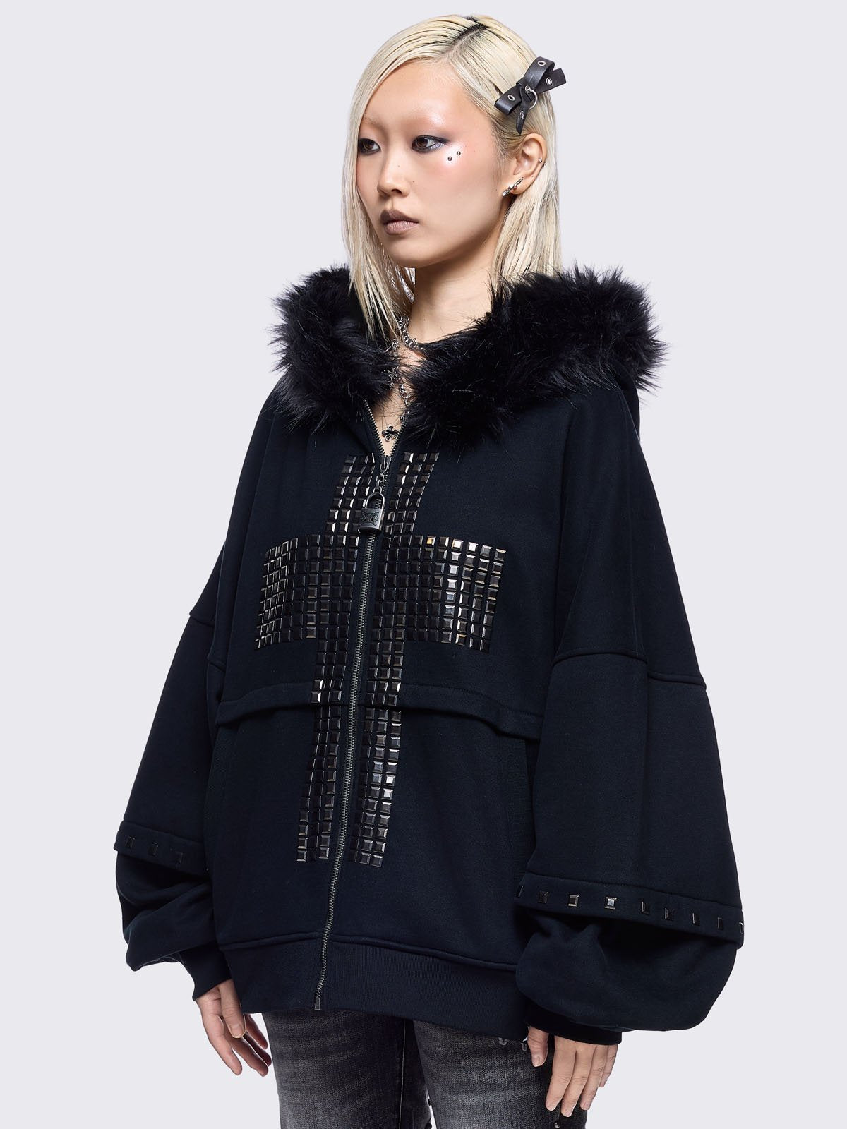 Black zip up hoodie jacket with faux fur hood with silver studded cross.