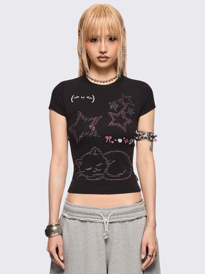 Black baby tee with kitty and stars graphic with stud and embroidery details.