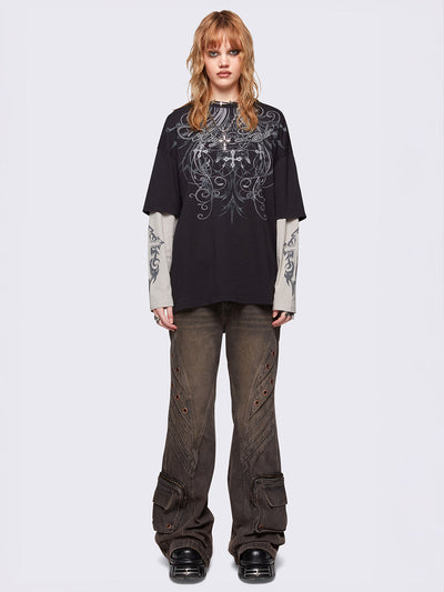 Black layered long sleeve t-shirt with grunge graphic front print and off-white contrast sleeves with cross print. Relaxed fit and crew neck.