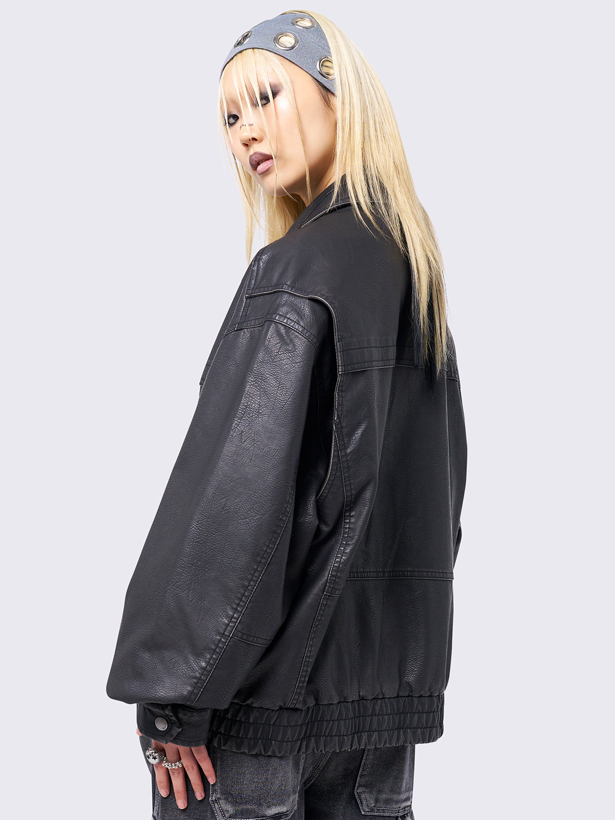 Black washed faux leather bomber jacket featuring a boxy oversize fit.