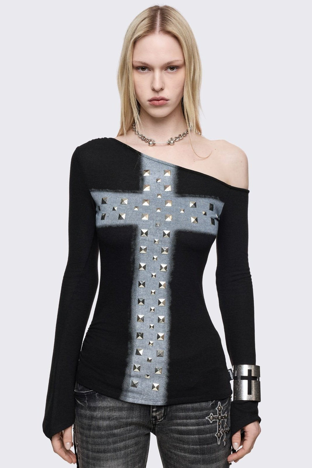 Black long sleeve top with off shoulder style anda c grey chunky cross with silver studs on front. 