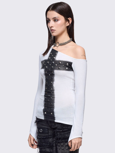 White off-shoulder top featuring a black chunky cross with silver square studs and ruched tie side detail.