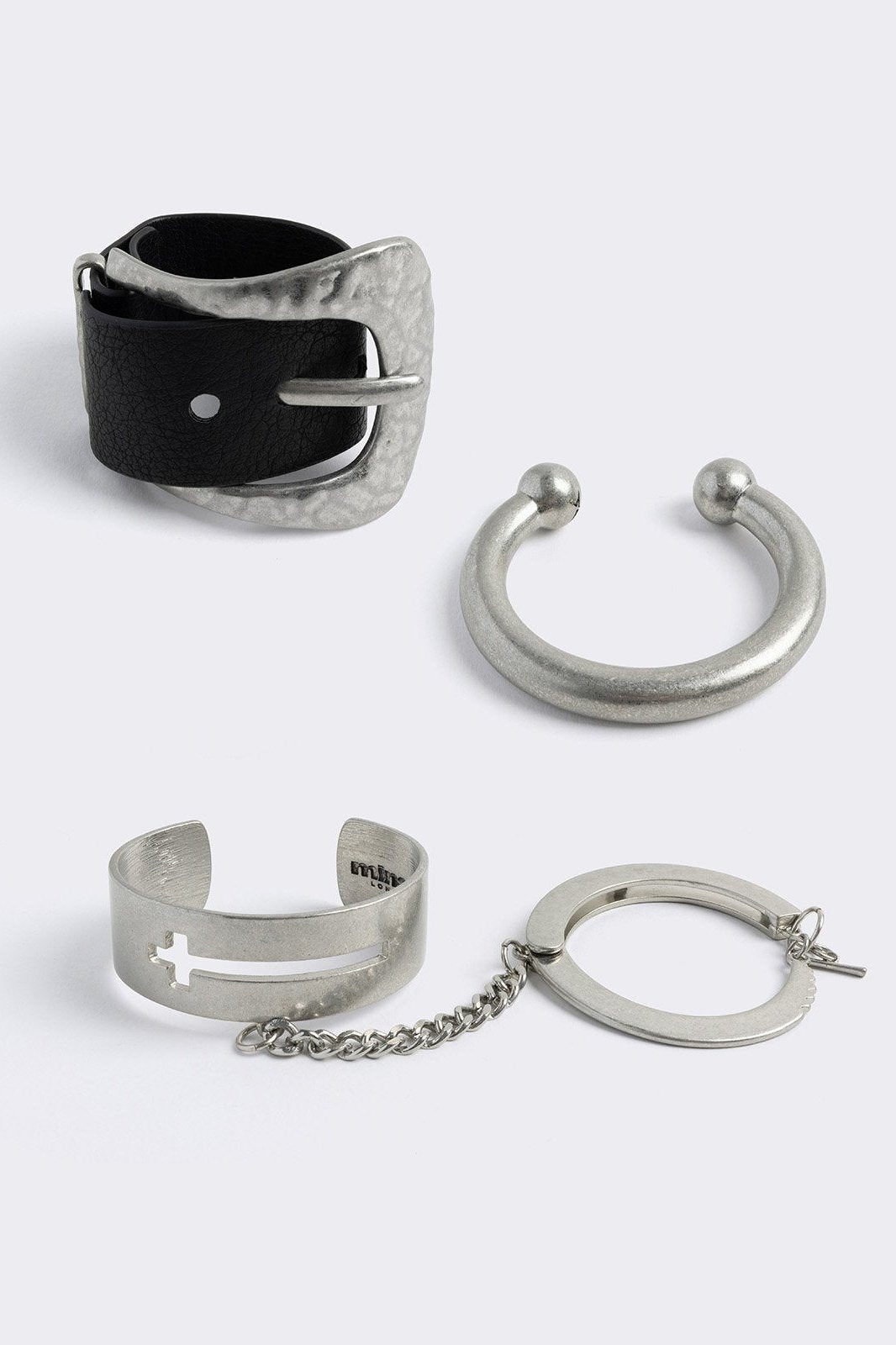 Set of 3 bracelet set, with mixed designs include faux leather buckle, cross designs and linked chains. 