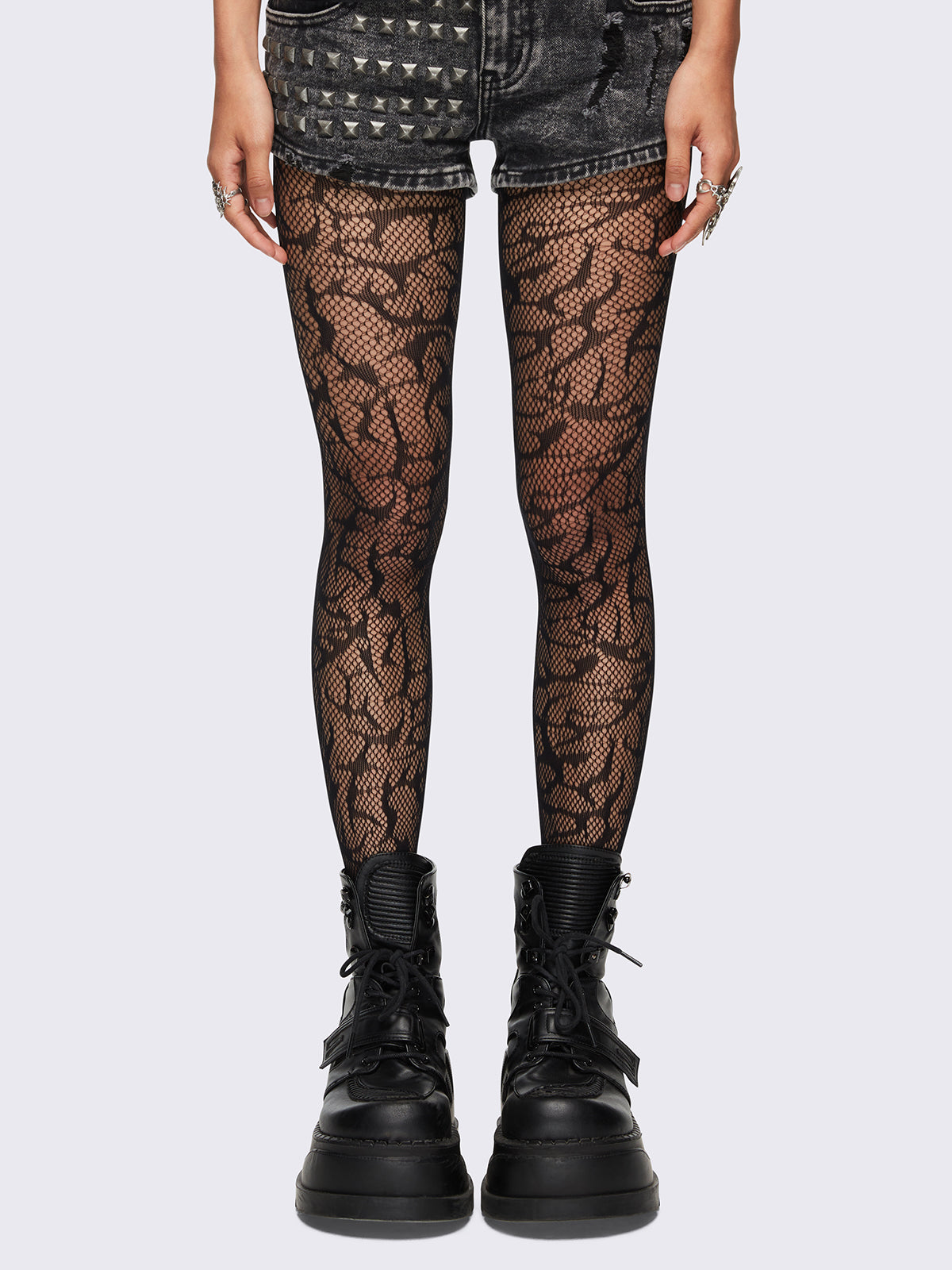 Black sigilism tribal fishnet tights.
