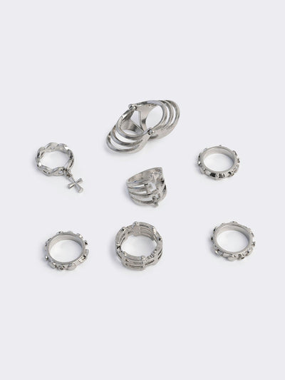 Silver set of 4 rings with cross designs.