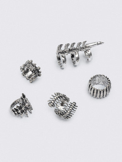 Set of 5 silver rings with centipede, spine and spike designs. 