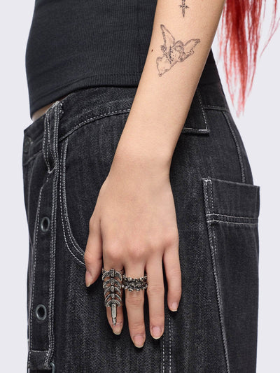 Set of 5 silver rings with centipede, spine and spike designs. 