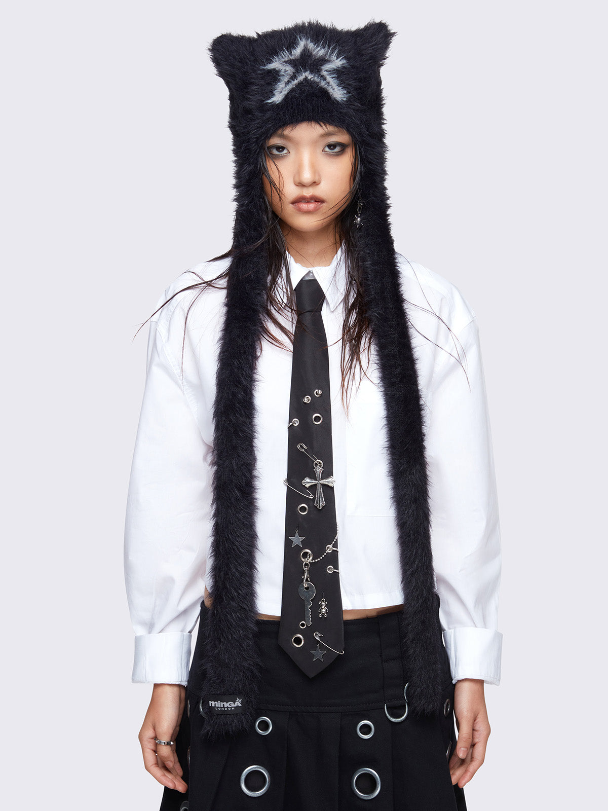 Black faux fur beanie hat with long strap featuring a star front design in light grey.