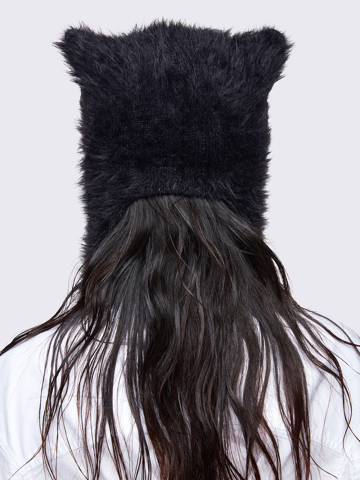 Black faux fur beanie hat with long strap featuring a star front design in light grey.