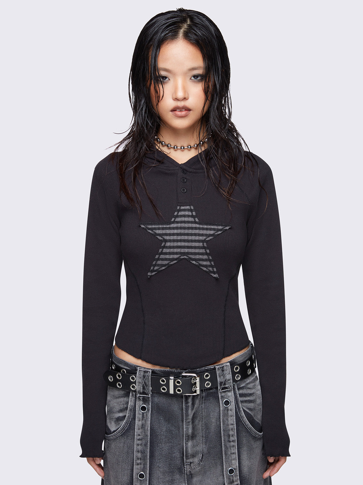 Hooded top in black featuring front grey stripes star patch and half button placket.