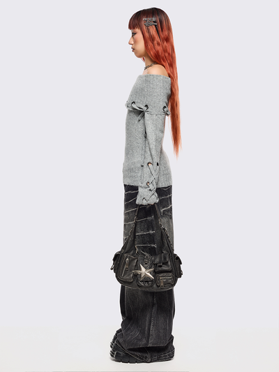 Black washed faux leather shoulder bag with silver star clasp, hardware details and multiple pockets.