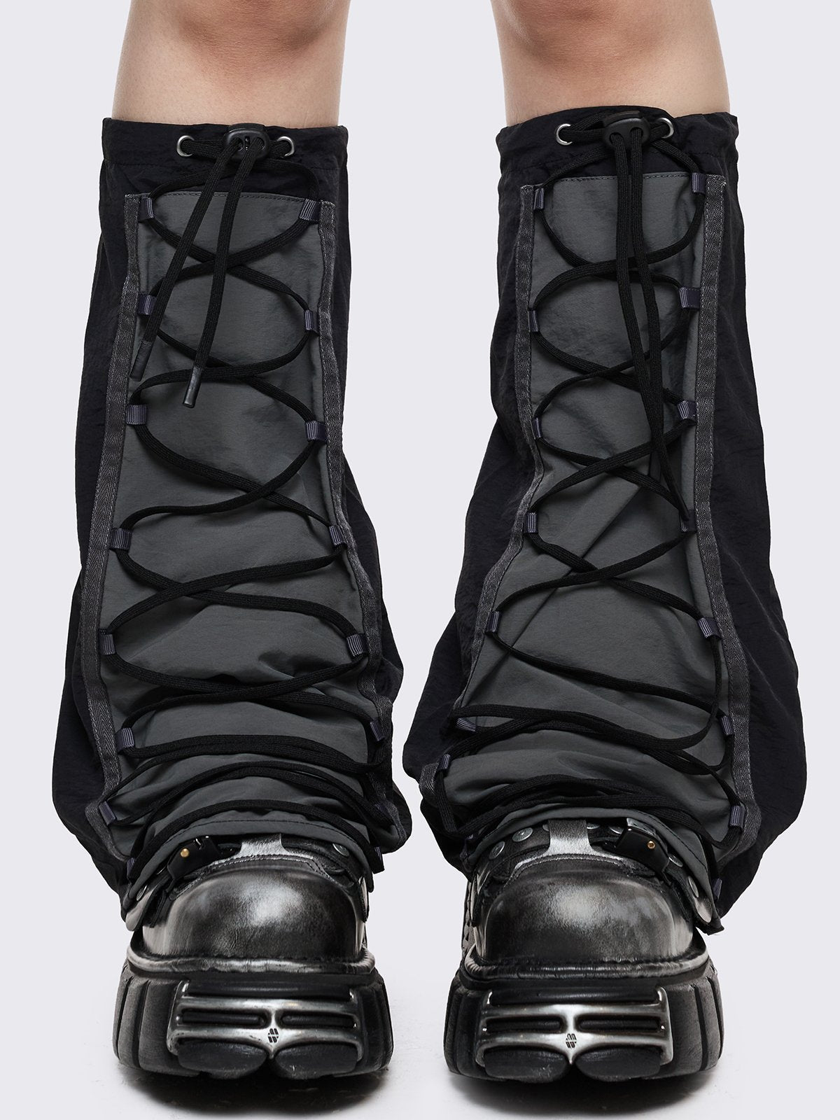 Black tech flared leg warmers with grey panel with lace-up and adjustable toggle