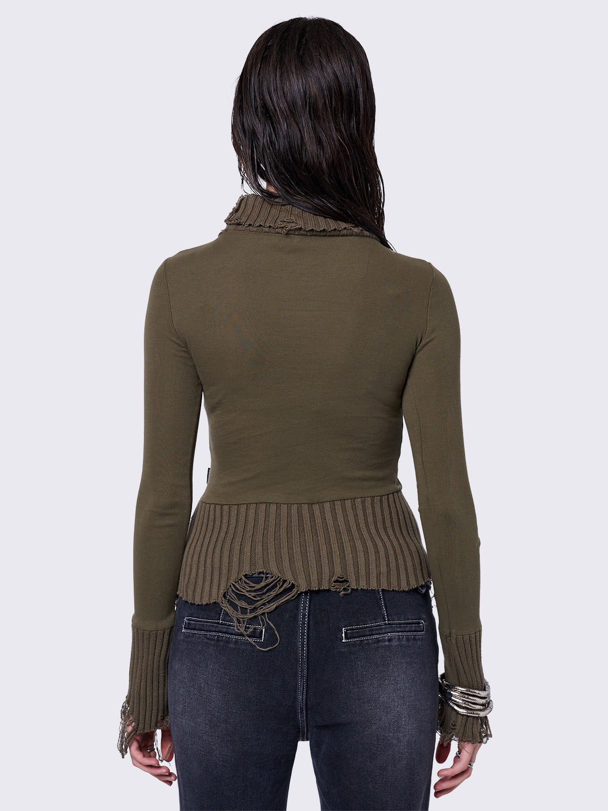 Khaki high-neck long sleeve top with a grunge graphic print on the front, featuring distressed chunky ribbed trims.