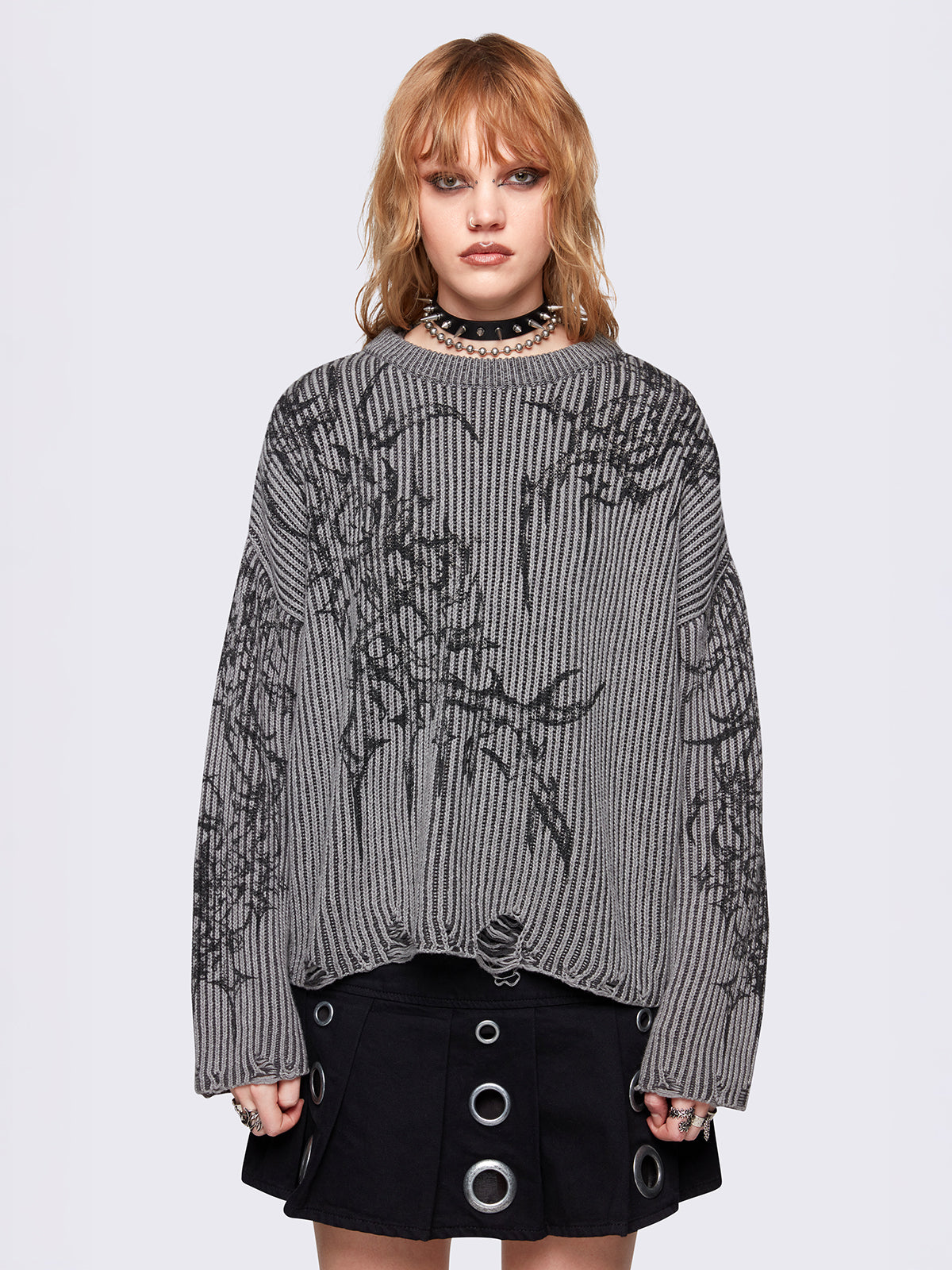 Grey marl knitted sweater with a bold tribal sigilism graphic print. Chunky ribbed knit with distressed details, perfect for grunge and Y2K alt fashion aesthetics.