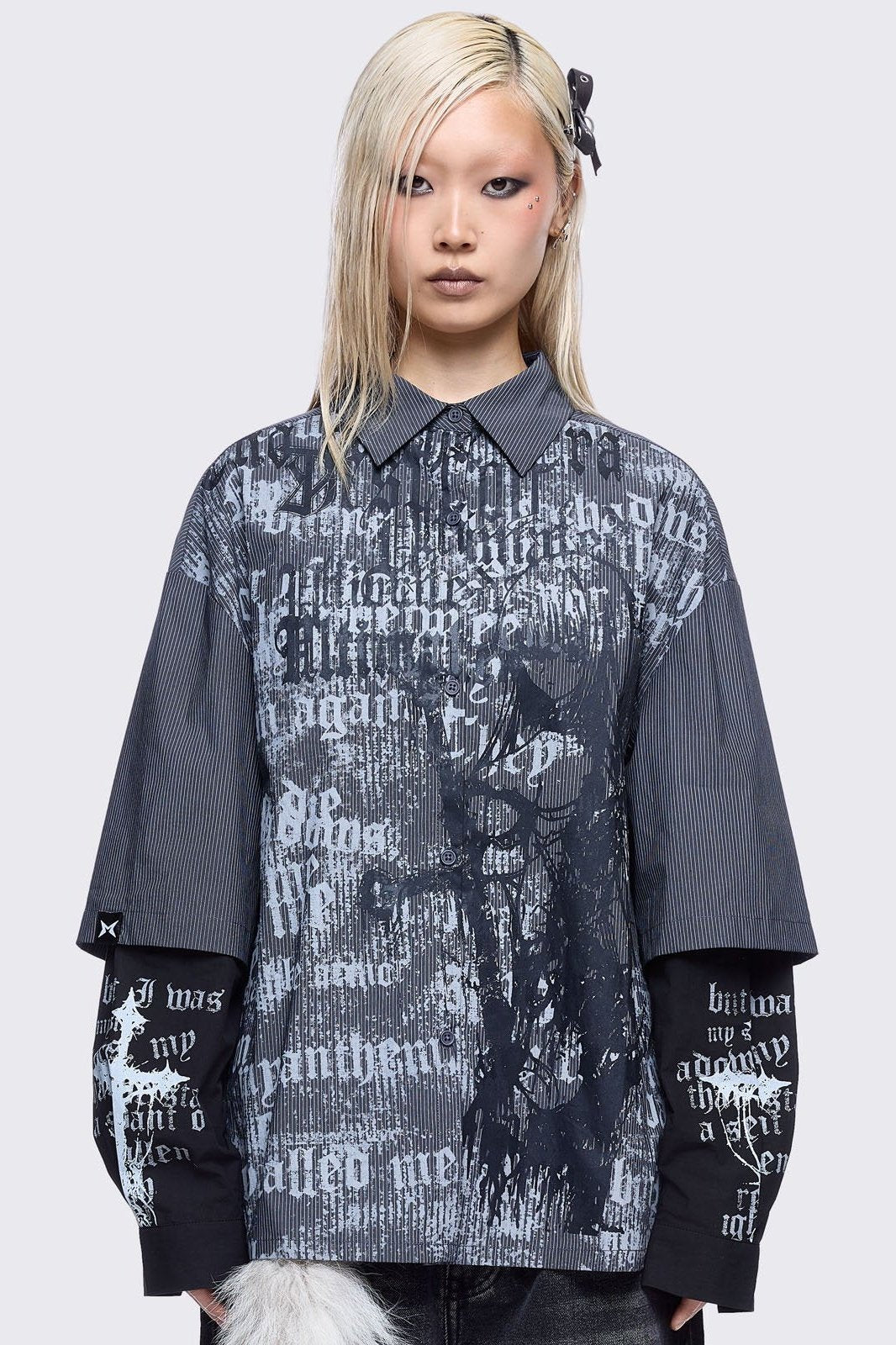 Two-piece gothic shirt ensemble featuring a pinstriped outer layer with a distressed text print, over black long sleeves detailed with white gothic text and imagery.