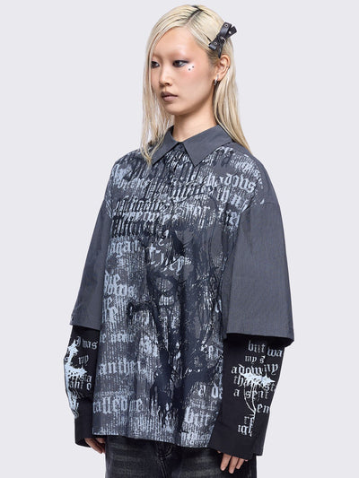 Two-piece gothic shirt ensemble featuring a pinstriped outer layer with a distressed text print, over black long sleeves detailed with white gothic text and imagery.