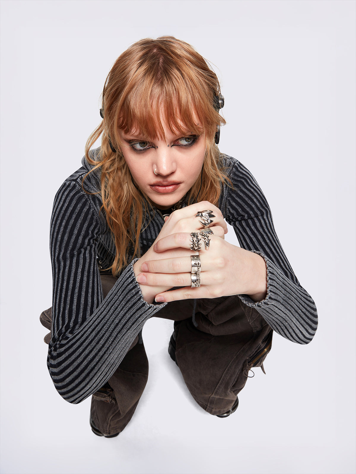 Set of 6 silver rings featuring a corset, spikes, thorns and chain designs. Slim and chunky bands styles. 