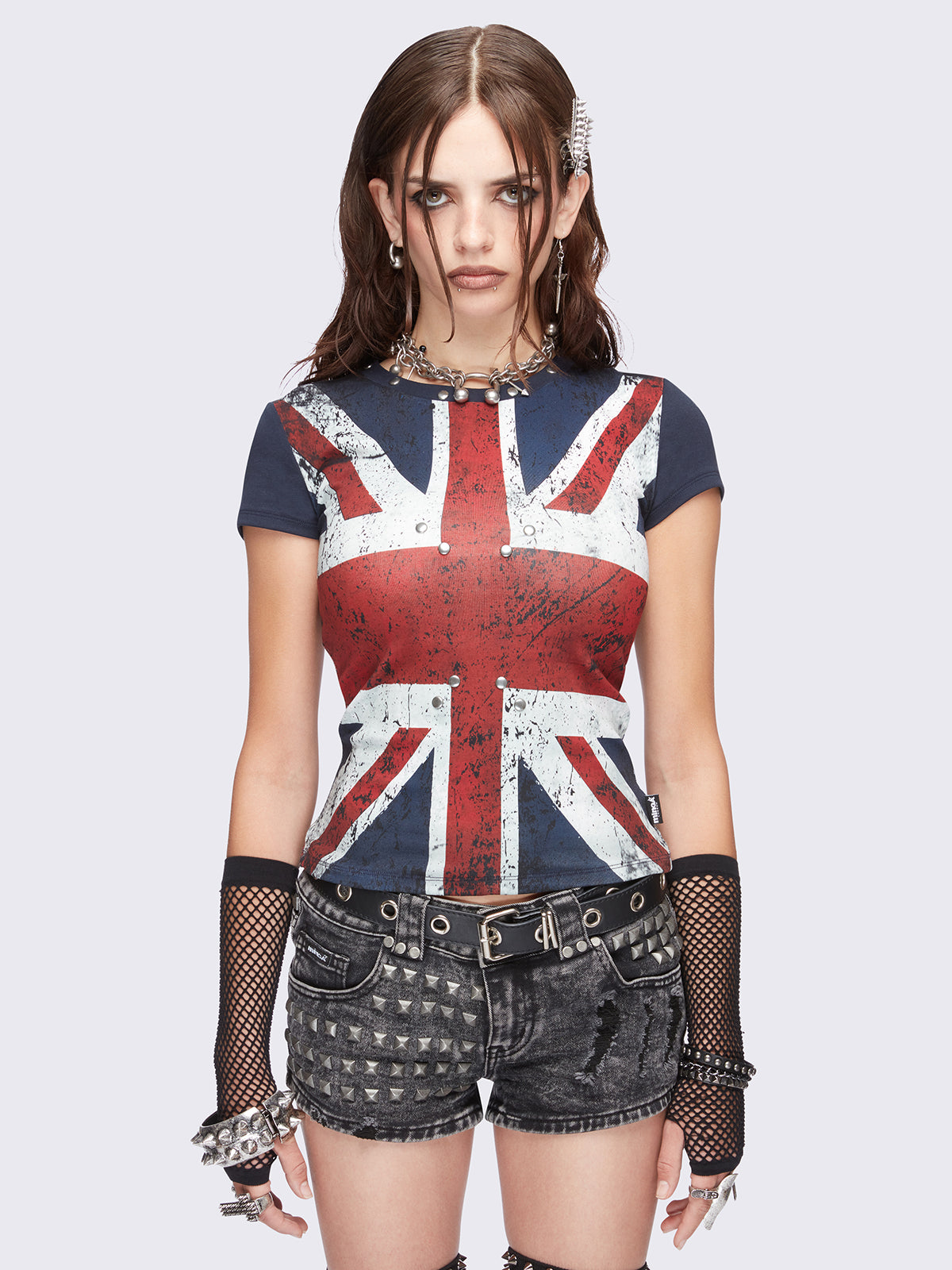 Red and blue graphic baby tee with UK flag print featuring stud details.