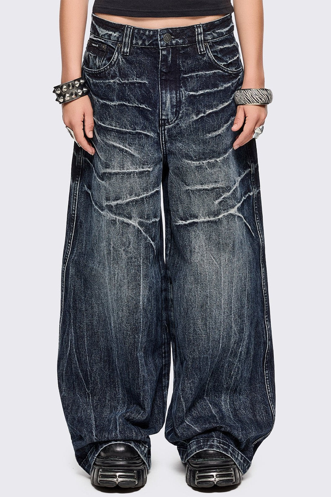 Blue washed wide leg baggy jeans featuring a grey overdye and distressed wrinkle-effect.