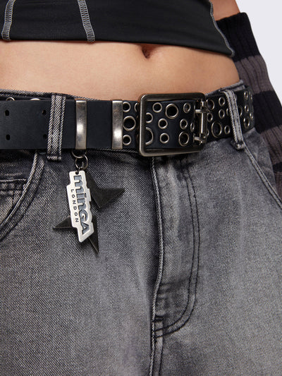 Double grommet leather belt in black with eyelets and minga logo pendant