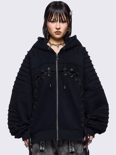 Black zip up hoodie jacket featuring a moto pintuck panels and front lace corset details. 