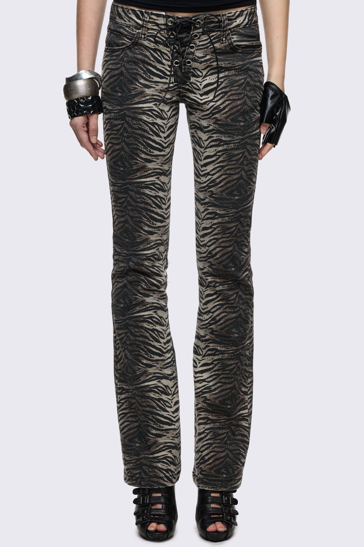 Bootcut jeans in brown stretch cotton with zebra print and lace-up front, low-rise Y2K grunge style.