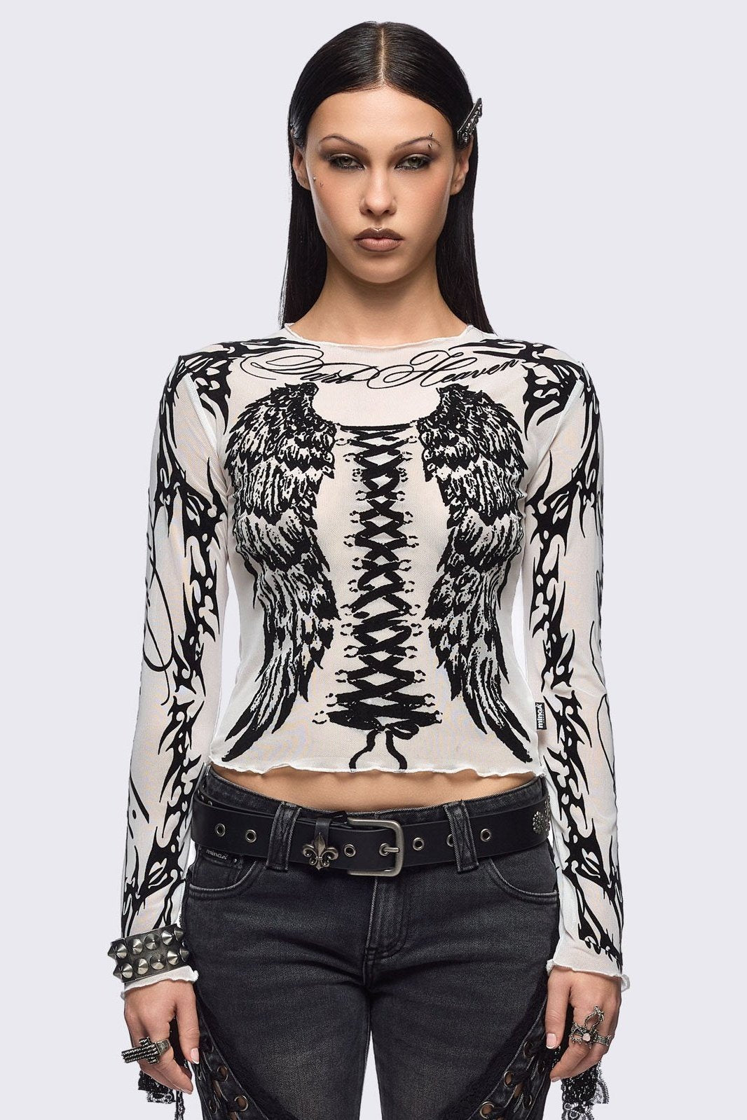 White mesh top with black winged corset and sigilism graphic print.