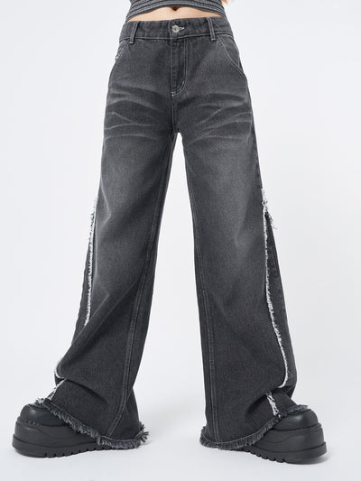 Wide leg jeans in washed black with contrast stitching in white and distressed side details